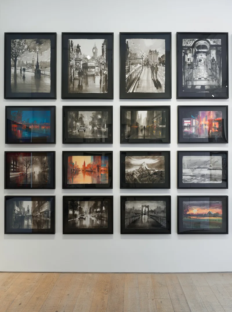 Grid of artisan paper works featuring cityscapes, bridges, and mountain scenes