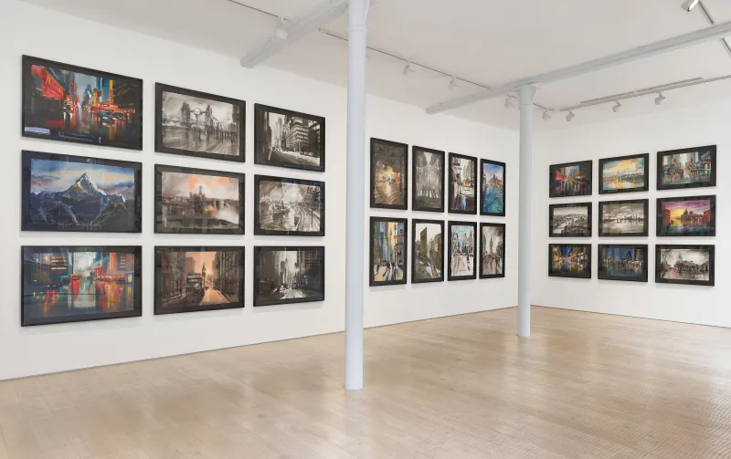Wide gallery view of landscape artisan paper works in floating frames