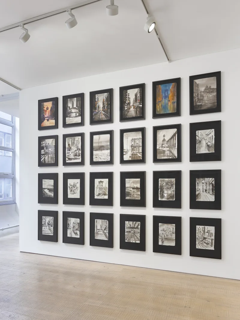 Salon-style wall arrangement of artisan paper works in various sizes