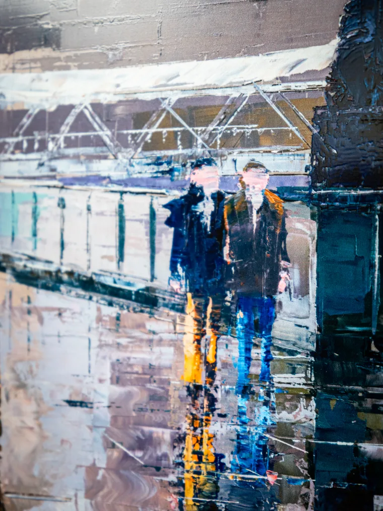 Detail of a framed Paul Kenton limited edition print: two figures beneath a glass-roofed station arcade, mirrored in the rain-soaked platform below